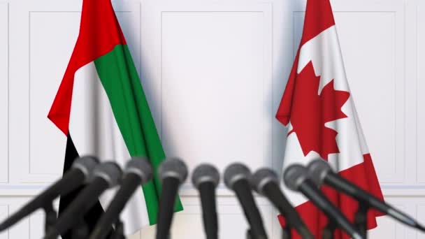 Zászlók, Kanada és az Egyesült Arab Emírségek sajtótájékoztatón nemzetközi értekezlet vagy a tárgyalások — Stock videók
