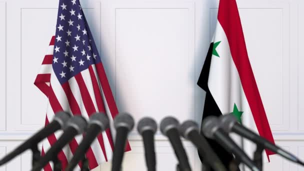 Flags of the USA and Syria at international meeting or negotiations press conference — Stock Video