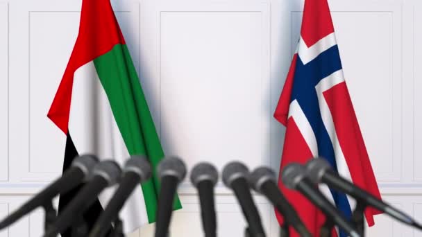 Flags of the UAE and Norway at international meeting or negotiations press conference — Stock Video