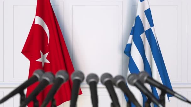 Flags of Turkey and Greece at international meeting or negotiations press conference — Stock Video