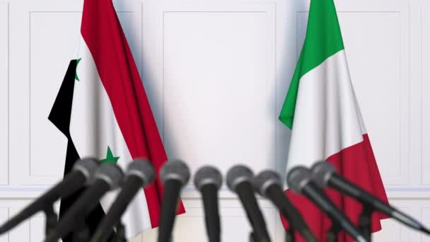 Flags of Syria and Italy at international meeting or negotiations press conference — Stock Video