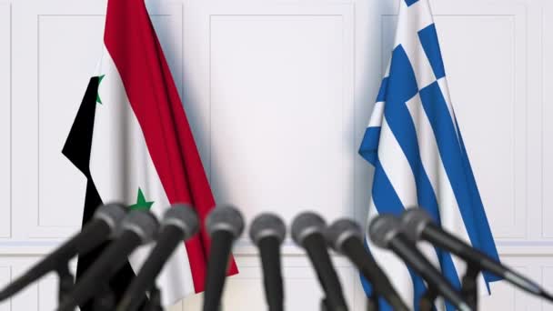 Flags of Syria and Greece at international meeting or negotiations press conference — Stock Video
