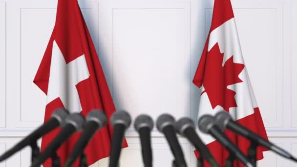 Bendera Swiss dan Kanada pada pertemuan internasional atau konferensi pers negosiasi — Stok Video