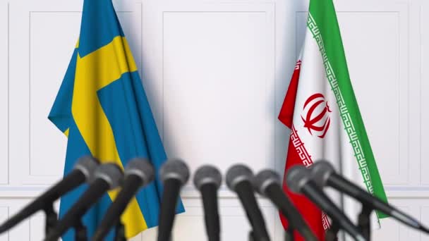 Banderas de Suecia e Irán en reunión internacional o en conferencia de prensa de negociaciones — Vídeo de stock