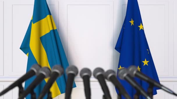 Flagi Unii Europejskiej na międzynarodowej konferencji prasowej spotkania lub negocjacji i Szwecja — Wideo stockowe