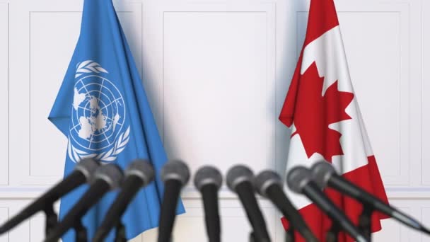 Banderas de las Naciones Unidas y Canadá en la reunión internacional o en la conferencia de prensa de negociaciones — Vídeos de Stock