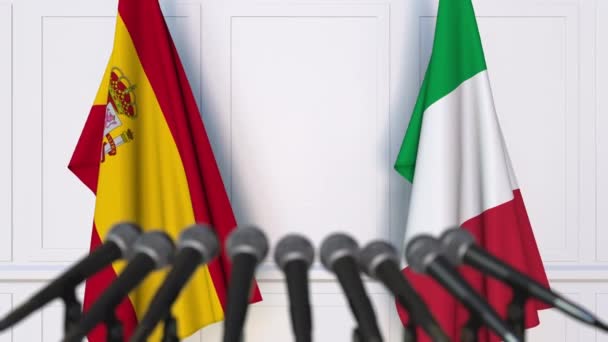 Flags of Spain and Italy at international meeting or negotiations press conference — Stock Video