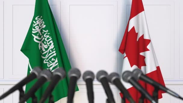 Flagi, Arabia Saudyjska i Kanada, międzynarodowej konferencji prasowej spotkania lub negocjacji — Wideo stockowe