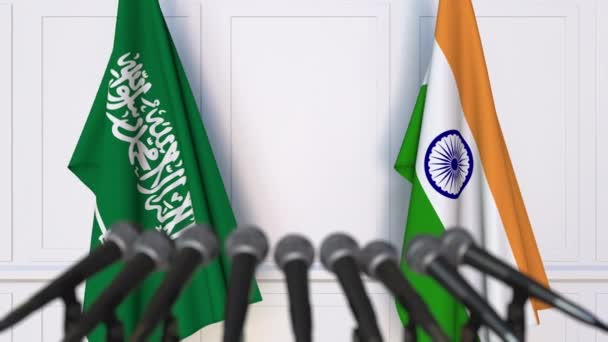 Прапори Саудівської Аравії та Індії на міжнародні зустрічі або переговорів прес-конференції — стокове відео