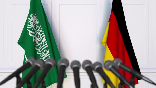 Banderas de Arabia Saudita y Alemania en reunión internacional o en conferencia de prensa de negociaciones — Vídeos de Stock