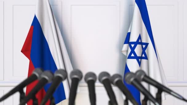 Flags of Russia and Israel at international meeting or negotiations press conference — Stock Video