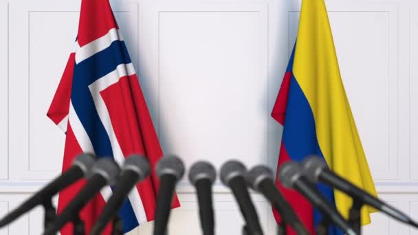 Flags of Norway and Colombia at international meeting or negotiations press conference — Stock Video