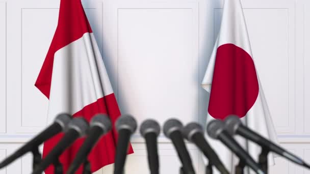 Прапори Перу і Японії на міжнародні зустрічі або переговорів прес-конференції — стокове відео