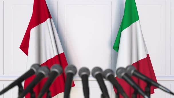Flags of Peru and Italy at international meeting or negotiations press conference — Stock Video