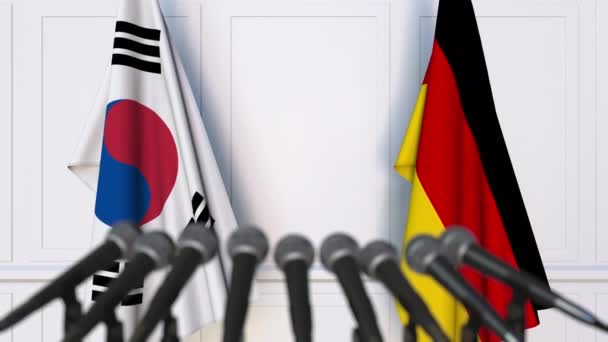 Bandiere della Corea del Sud e della Germania alla riunione internazionale o alla conferenza stampa dei negoziati — Video Stock