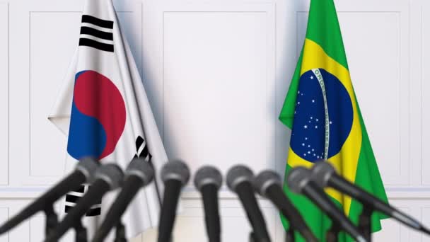 Прапори Південної Кореї і Бразилії на міжнародні зустрічі або переговорів прес-конференції — стокове відео