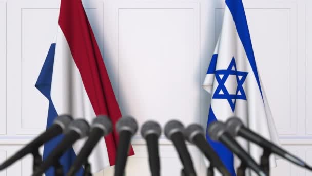 荷兰和以色列在国际会议或谈判中的旗帜新闻发布会 — 图库视频影像