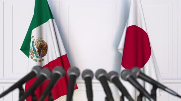Flagi, Meksyku i Japonii, międzynarodowej konferencji prasowej spotkania lub negocjacji — Wideo stockowe