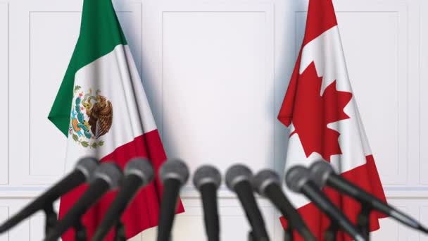 Banderas de México y Canadá en reunión internacional o conferencia de prensa de negociaciones — Vídeo de stock