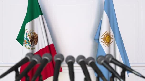 Прапори Мексики та Аргентини на міжнародні зустрічі або переговорів прес-конференції — стокове відео