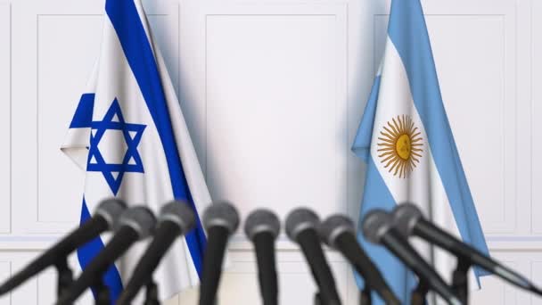 Bandeiras de Israel e Argentina em reunião internacional ou negociações conferência de imprensa — Vídeo de Stock