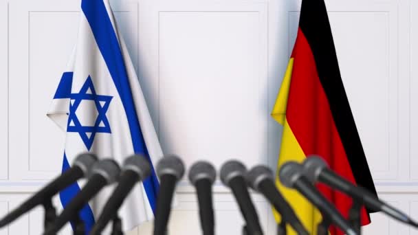 Flaggor av Israel och Tyskland vid internationella förhandlingar eller möte presskonferens — Stockvideo