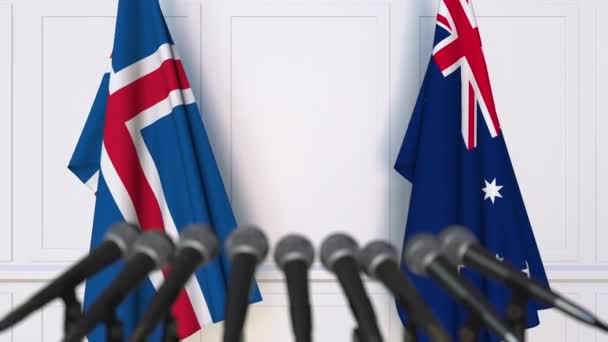 国際会議や交渉の記者会見でアイスランド、オーストラリアの国旗 — ストック動画