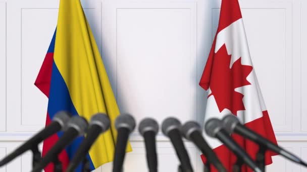 Drapeaux de la Colombie et du Canada lors d'une réunion internationale ou d'une conférence de presse — Video