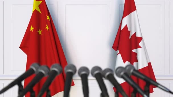 Bandeiras da China e do Canadá em reunião internacional ou negociações conferência de imprensa — Vídeo de Stock