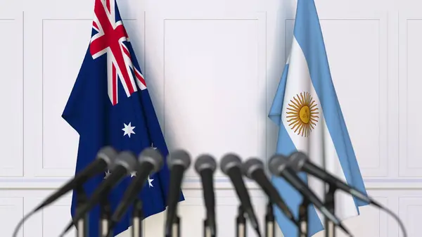 Flaggen Australiens und Argentiniens bei internationalen Treffen oder Konferenzen. 3D-Darstellung — Stockfoto