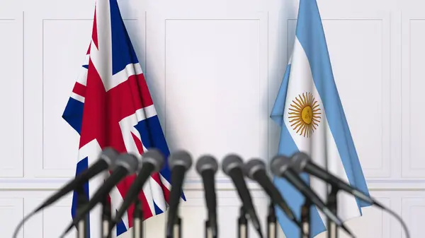 Flaggen des Vereinigten Königreichs und Argentiniens bei internationalen Treffen oder Konferenzen. 3D-Darstellung — Stockfoto