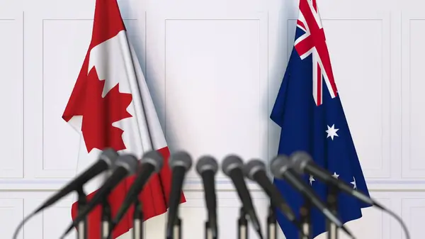 Flaggen Kanadas und Australiens bei internationalen Treffen oder Konferenzen. 3D-Darstellung — Stockfoto