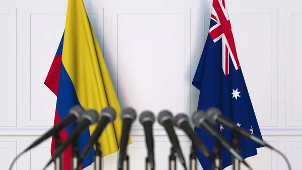 Bandeiras da Colômbia e Austrália em reunião ou conferência internacional. Renderização 3D — Fotografia de Stock