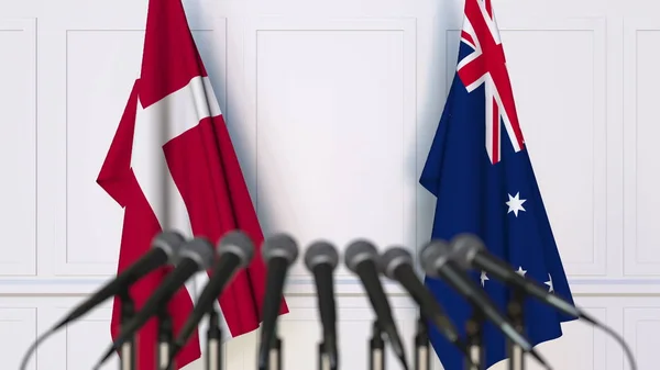 Flaggen Dänemarks und Australiens bei internationalen Treffen oder Konferenzen. 3D-Darstellung — Stockfoto