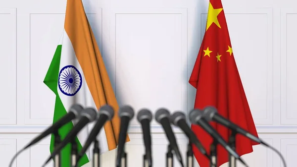 Flags of India and China at international meeting or conference. 3D rendering — Stock Photo, Image