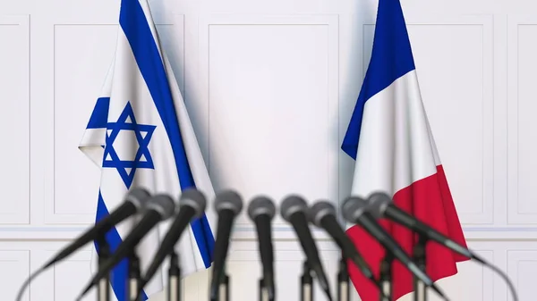 Drapeaux d'Israël et de la France lors d'une réunion ou conférence internationale. rendu 3D — Photo