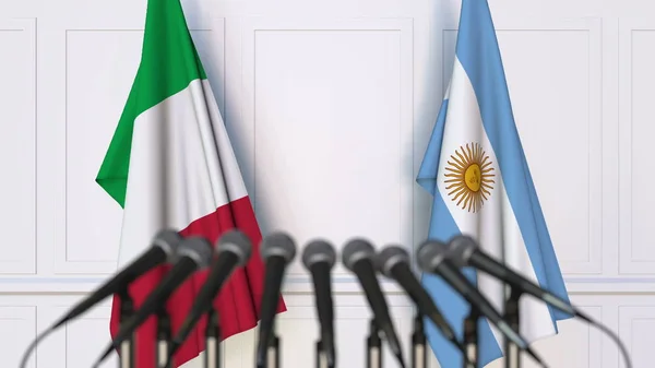 Banderas de Italia y Argentina en reunión o conferencia internacional. Renderizado 3D — Foto de Stock