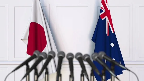 Flaggor i Japan och Australien på internationellt möte eller konferens. 3D-rendering — Stockfoto