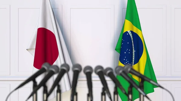 Флаги Японии и Бразилии на международной встрече или конференции. 3D рендеринг — стоковое фото