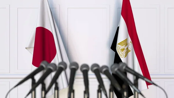 Flaggor av Japan och Egypten på internationellt möte eller konferens. 3D-rendering — Stockfoto