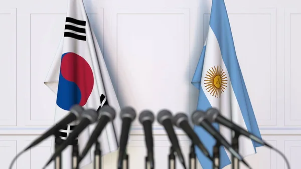 Flaggen Südkoreas und Argentiniens bei internationalen Treffen oder Konferenzen. 3D-Darstellung — Stockfoto