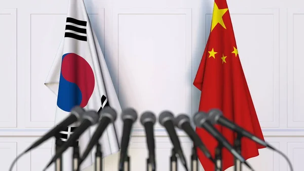 韩国和中国在国际会议或会议上的旗帜。3d 渲染 — 图库照片