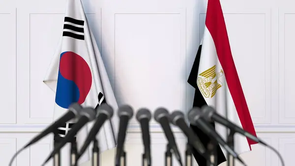 Flaggen Südkoreas und Ägyptens bei internationalen Treffen oder Konferenzen. 3D-Darstellung — Stockfoto