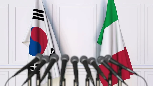 Flaggen Südkoreas und Italiens bei internationalen Treffen oder Konferenzen. 3D-Darstellung — Stockfoto