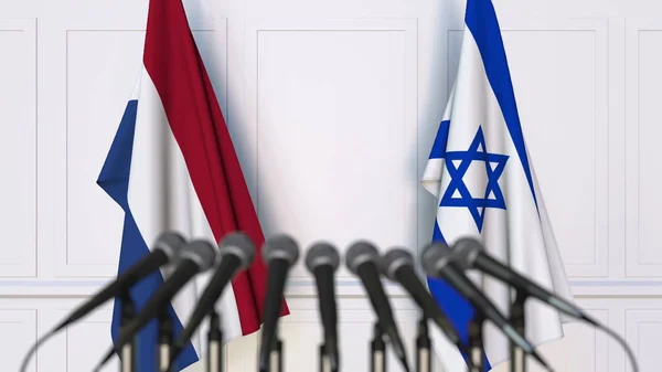 Drapeaux des Pays-Bas et d'Israël lors d'une réunion ou conférence internationale. rendu 3D — Photo