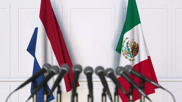 Banderas de los Países Bajos y México en reunión o conferencia internacional. Renderizado 3D —  Fotos de Stock