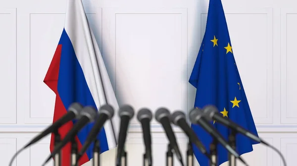 Bandeiras da Rússia e da União Europeia em reunião ou conferência internacional. Renderização 3D — Fotografia de Stock