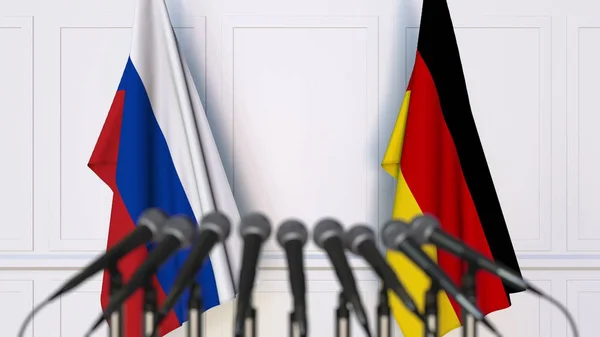 국제 회의 또는 회의에서 러시아와 독일의 플래그입니다. 3 차원 렌더링 — 스톡 사진