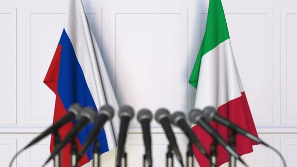 俄罗斯和意大利在国际会议或会议上的旗帜。3d 渲染 — 图库照片