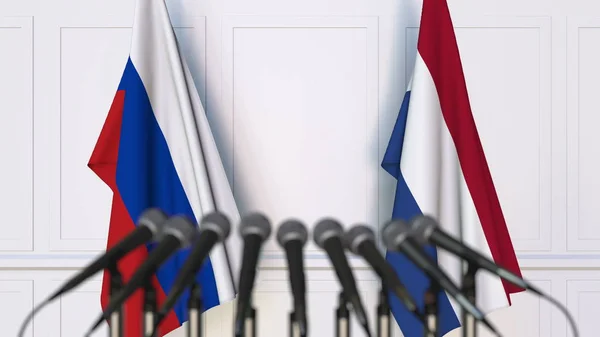 Флаги России и Нидерландов на международной встрече или конференции. 3D рендеринг — стоковое фото